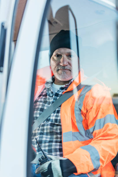 istock Hispanic man driving a truck 1145094895