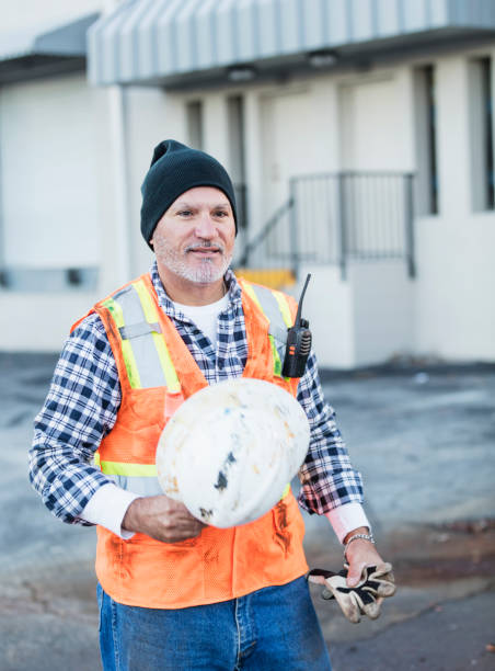 istock Hispanic worker outside with hardhat and safety vest 1145096061