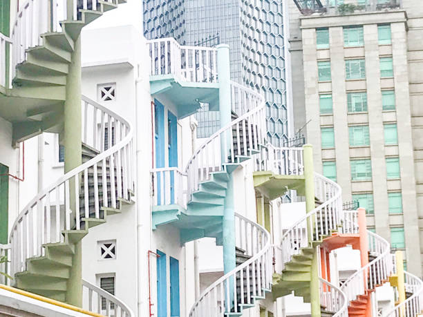 istock Row Apartments With Multi Colored Spiral Staircases In Singapore 1145096077