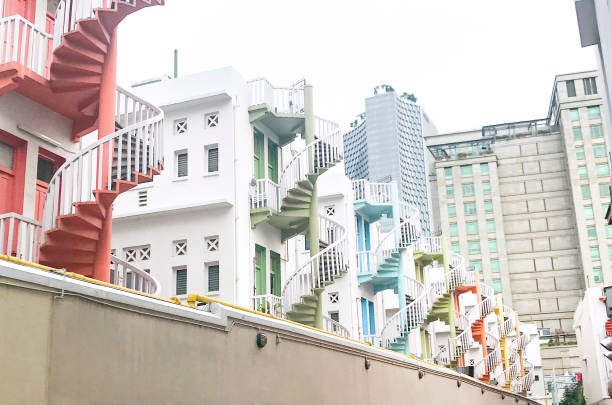 istock Row Apartments With Multi Colored Spiral Staircases In Singapore 1145096080