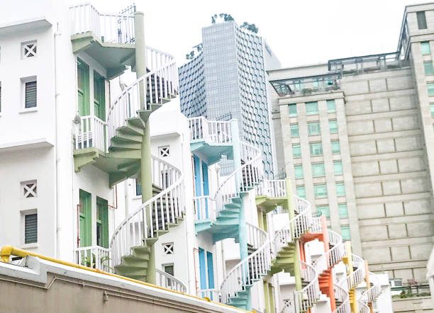 istock Row Apartments With Multi Colored Spiral Staircases In Singapore 1145096094