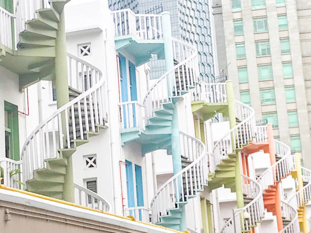 istock Row Apartments With Multi Colored Spiral Staircases In Singapore 1145096099