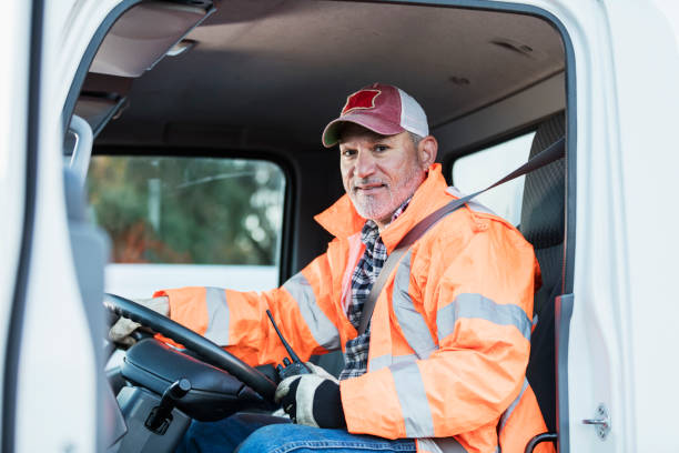 istock Hispanic man driving a truck 1145096146