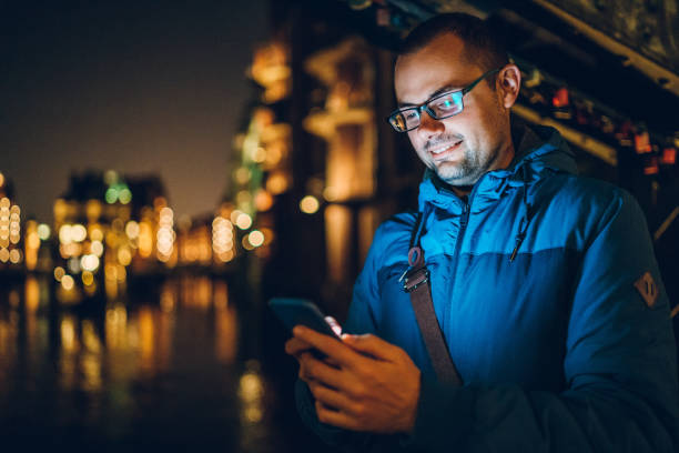 istock Using phone in Hamburg old town 1145097273