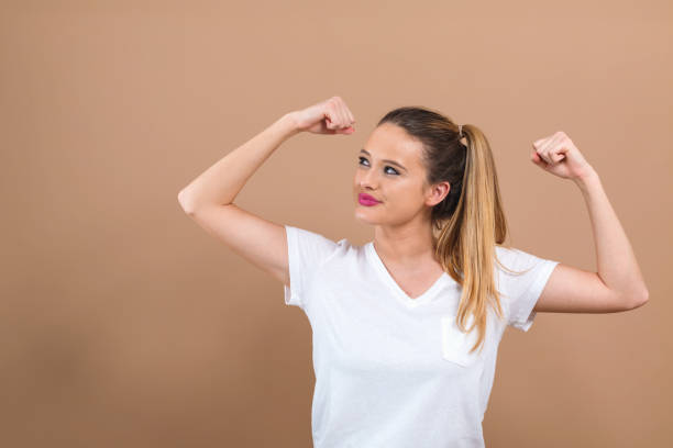 istock Powerful young woman in success pose 1145097822