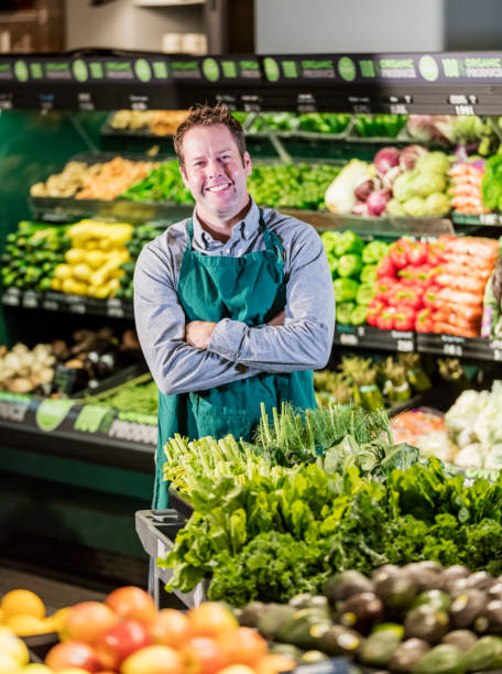 istock Man working in supermarket produce aisle 1145100206