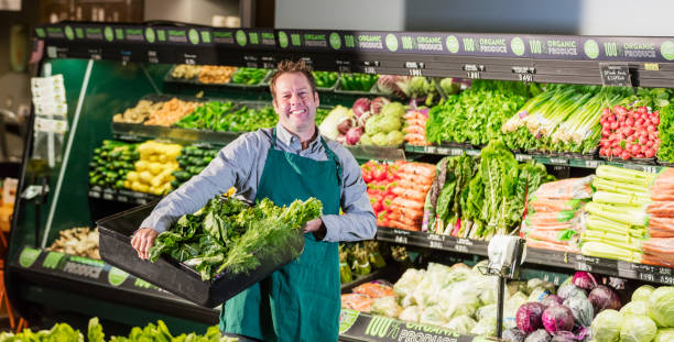 istock Man working in supermarket produce aisle 1145100283