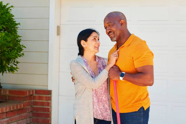 istock Mature Couple Working in Frontyard of Their Home 1145105503