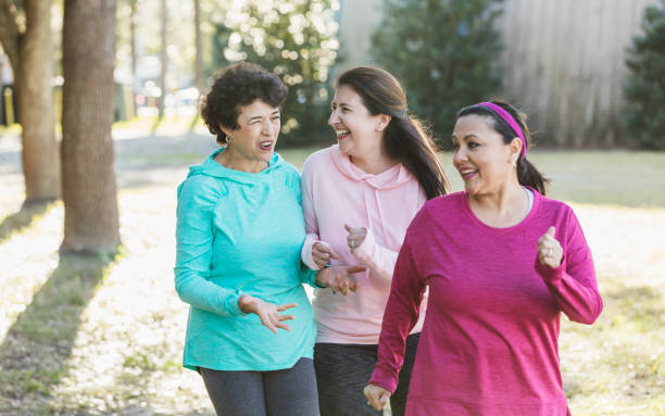 istock Three Hispanic woman in park, power walking 1145106510
