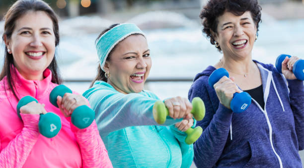 istock Three Hispanic women exercising together 1145106828