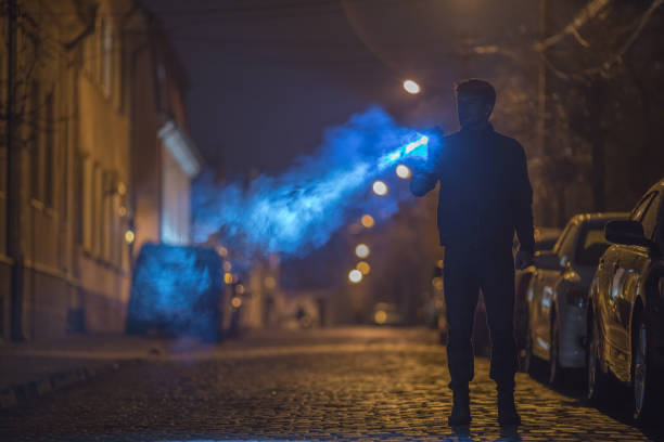 istock The man with a flashlight stand on the road. Evening night time 1145106912