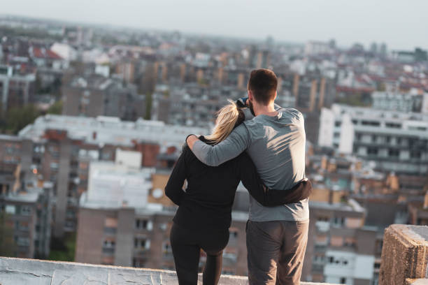 istock Couple on a building rooftop terrace 1145110325