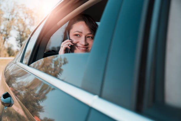 istock Powerful businesswoman using mobile phone in a backseat os a limousine 1145112086