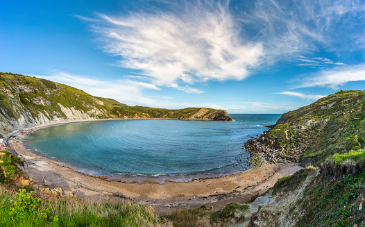 Along the Jurassic Coast, the cove is near the village of Lulworth.  Attracts over half a million visitors annually