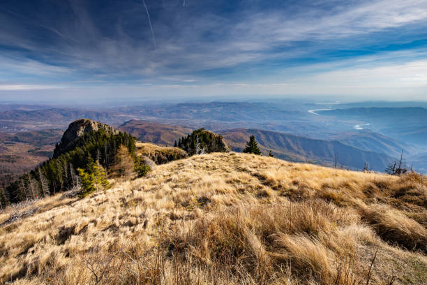 View from the top of Cozia mountains towards Olt river valley in Romania during autumn stock photo