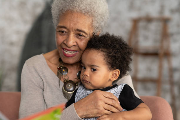 istock Senior woman reading with her grandson 1145120415