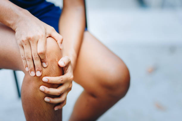 young women knee ache, healthcare concept stock photo