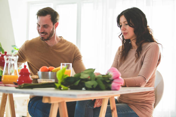 istock Man and woman having breakfast at home 1145121831