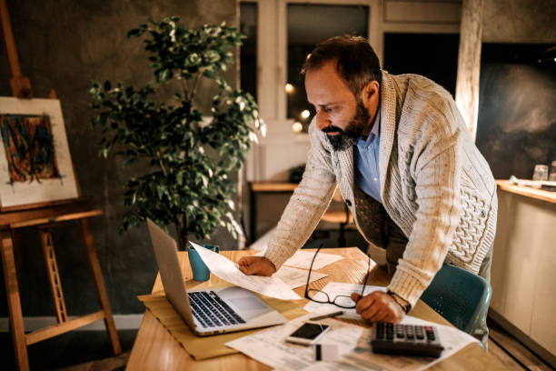 istock Man rechecking all his payments 1145124673