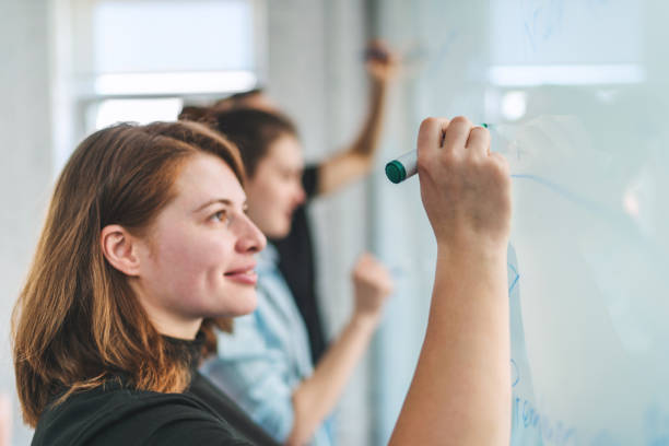 istock Group of young coworkers having project discussion 1145127093