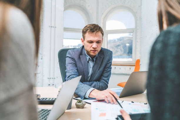 istock Young businessman having meeting with his colleagues 1145127099