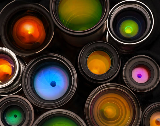 Abstract macro image depicting reflection and refraction on the front glass element of a camera lens.
