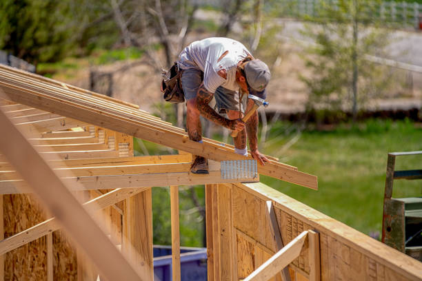 istock Rugged Carpenter on a Framing Crew Setting Trusses on a New Home 1145134278