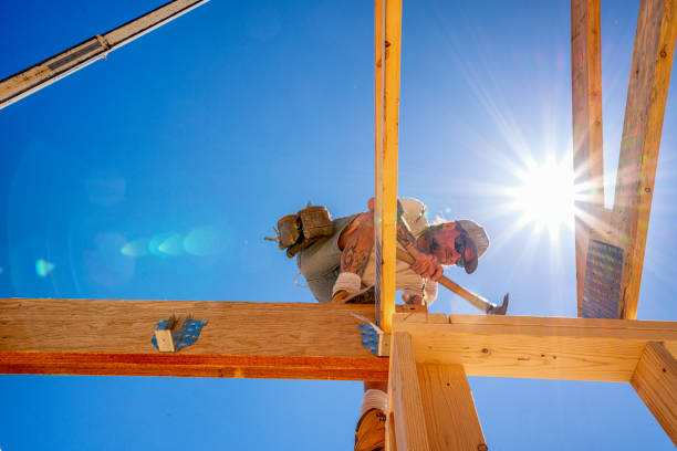 istock Rugged Carpenter on a Framing Crew Setting Trusses on a New Home 1145134318