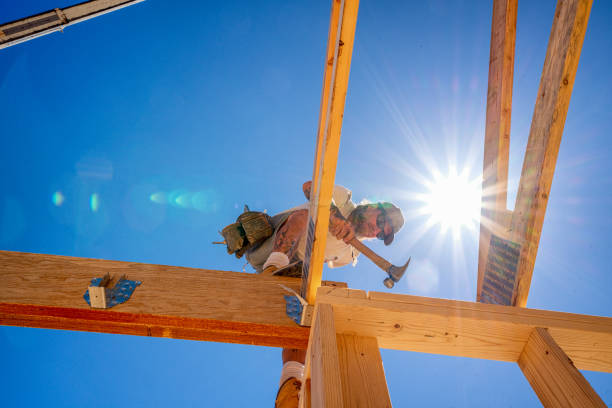 istock Rugged Carpenter on a Framing Crew Setting Trusses on a New Home 1145134357