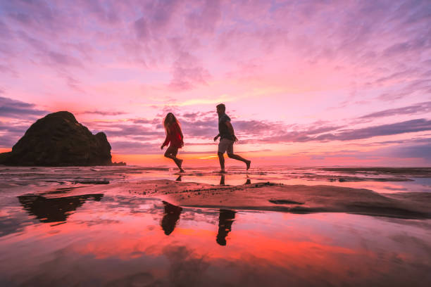 istock Couple at beach running. 1145137715