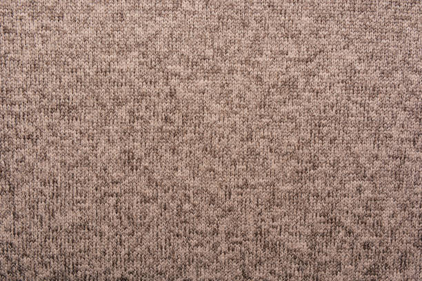 istock Abstract beige knitted fabric for background.Knitted texture. 1145140545