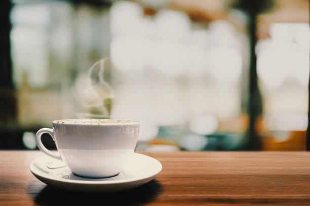 istock Hot coffee cup on wood table in cafe for background. 1145140595