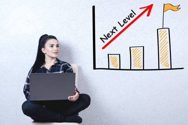 istock Next level concept with a young woman holding a laptop 1145140631