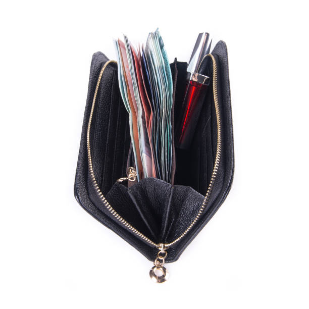 istock purse with dollars and credit cards on background 1145149121