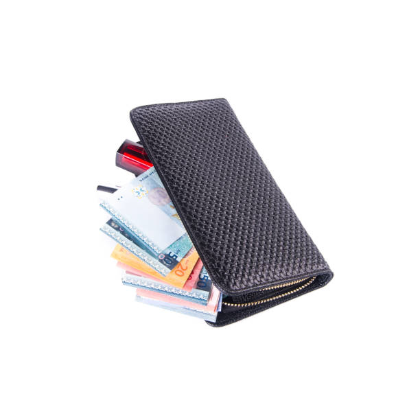 istock purse with dollars and credit cards on background 1145149129
