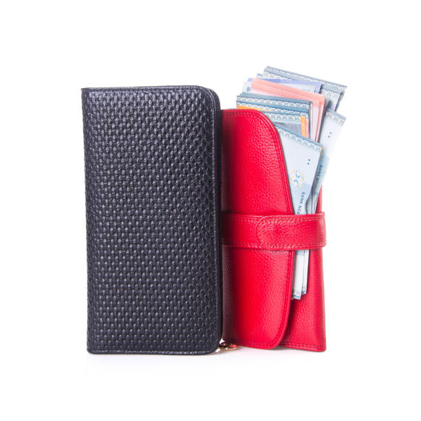 istock purse with dollars and credit cards on background 1145149135