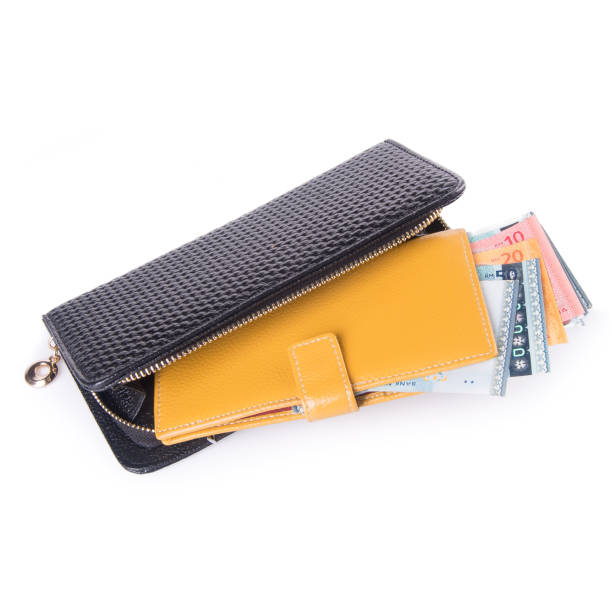 istock purse with dollars and credit cards on background 1145149157