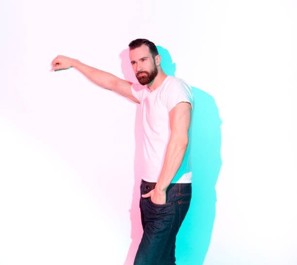 istock Handsome man standing with white shirt on white background 1145150194