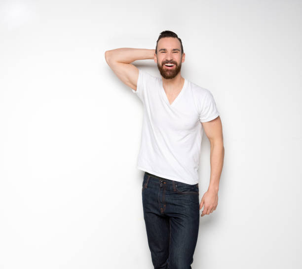istock Handsome man standing with white shirt on white background 1145150860