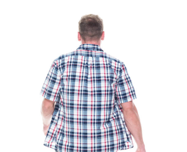 istock Handsome man in shirt and shorts is walking away 1145150920