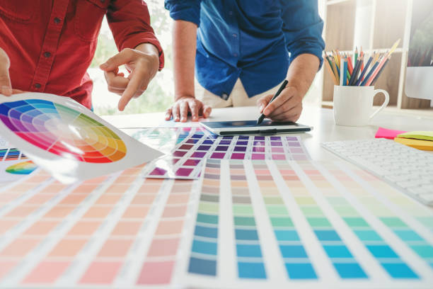 istock Two Graphic designer drawing on graphics tablet and color palette guide at workplace 1145151243