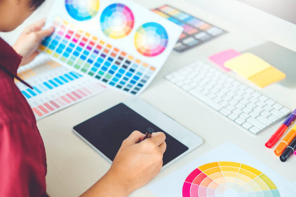 istock Graphic designer drawing on graphics tablet at workplace 1145151260