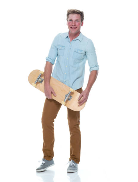 istock Casual well dressed man holding a skateboard 1145152246