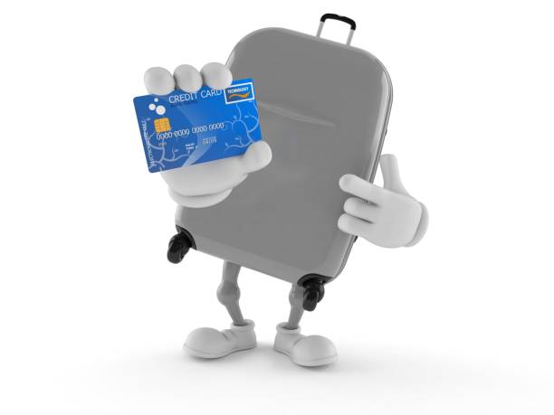 istock Suitcase character holding credit card 1145152561