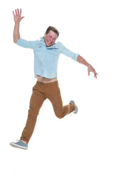 istock Casual well dressed man jumping 1145152637