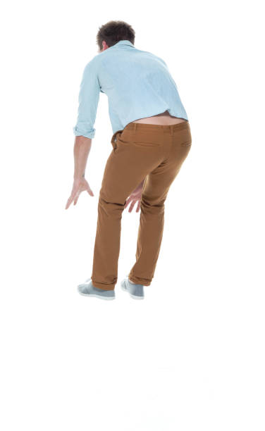 istock Casual well dressed man jumping 1145152641