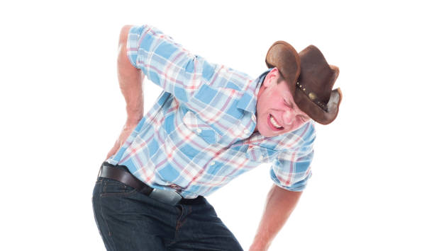 istock Handsome cowboy is having back pain 1145153591
