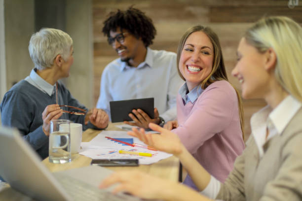 istock Group of multi generation business colleagues  in open hub office 1145153719