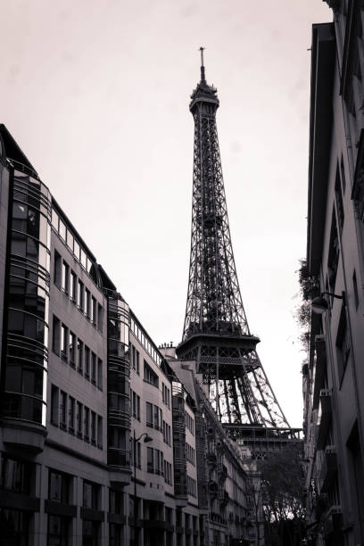 istock Black and white eiffel tower from alley 1145154678