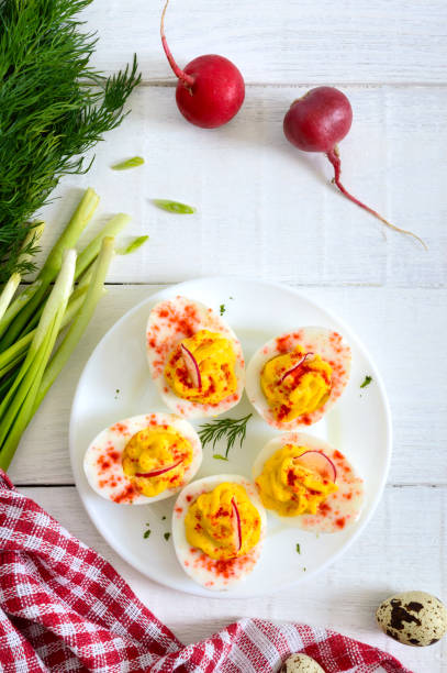 istock Deviled eggs. Delicious appetizer. Boiled eggs stuffed with yolk, mustard, mayonnaise, paprika. Classic recipe. The top view 1145164054